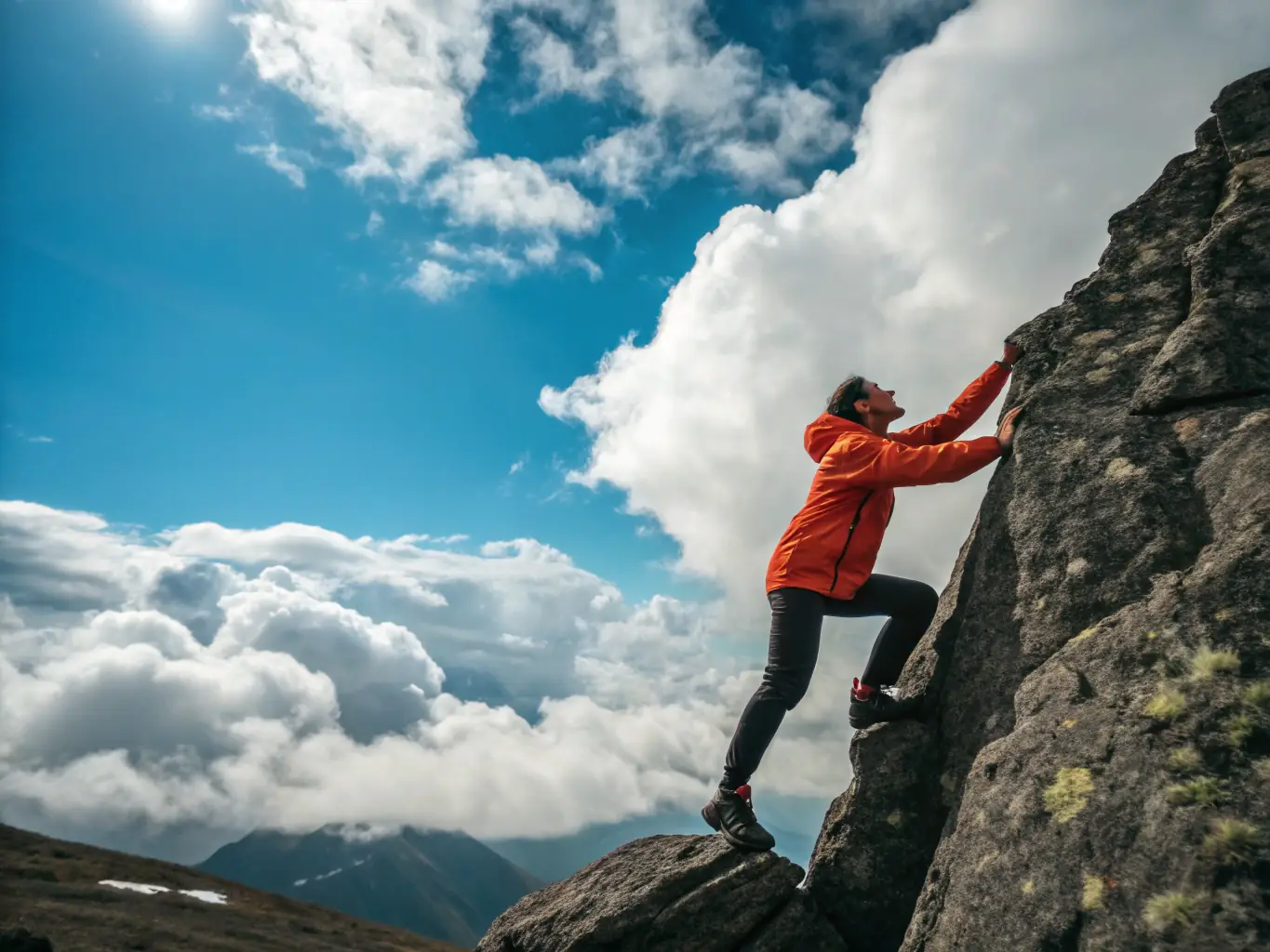 A person climbing a mountain, symbolizing overcoming challenges and achieving goals.